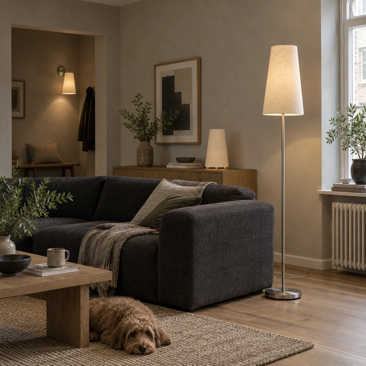 Stylish floor lamp illuminating a cozy living area with a dog.